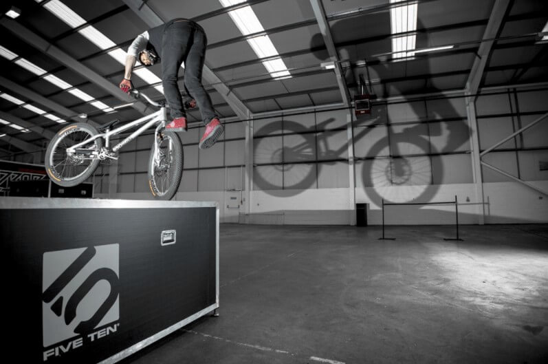 trials rider hopping up to a ledge on the back wheel